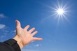 Фото: people hand pointing to a sun people hand pointing to a sun