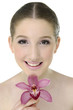 Close-up portrait of a beautiful girl with pink orchid Close-up portrait of a beautiful girl with pink orchid