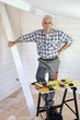 Man putting up tongue and groove