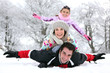 Photo: Family playing in the snow Family playing in the snow