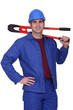 Craftsman with tongs over his shoulder Craftsman with tongs over his shoulder
