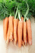 Fresh carrots on cutting board Fresh carrots on cutting board