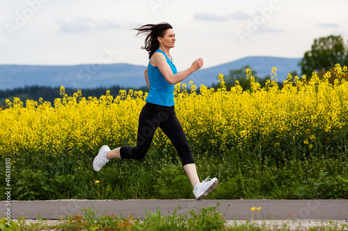 Photo: Woman running, jumping outdoor Woman running, jumping outdoor