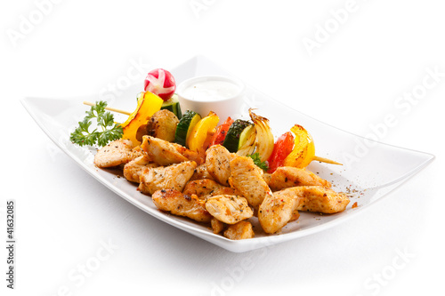 Photo: Grilled meat and vegetables on white background Grilled meat and vegetables on white background