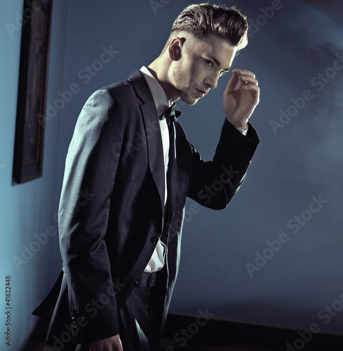 Photo: Handsome man wearing suit Handsome man wearing suit