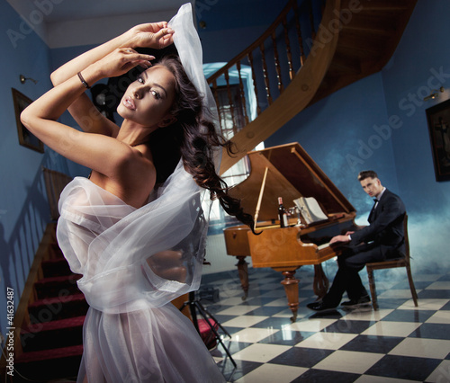 Photo: Sexy woman dancing to the piano music Sexy woman dancing to the piano music