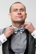 Guy corrects bowtie