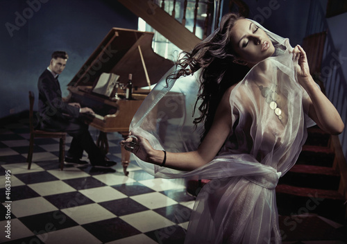 Photo: Sexy woman dancing to the piano music Sexy woman dancing to the piano music
