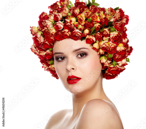 Foto: Portrait of young beautiful woman with roses in hair, on white b Portrait of young beautiful woman with roses in hair, on white b