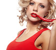Young woman with chili pepper isolated on white