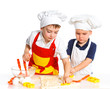 Two beautiful caucasian brothers making a cake
