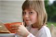 Little girl having breakfast