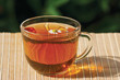 Photo: Cup of herbal tea and chamomile still life Cup of herbal tea and chamomile still life