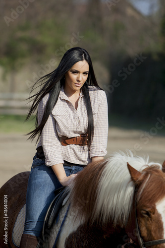 Photo: Girl riding on a horse Girl riding on a horse