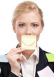 Foto: Businesswoman holding a yellow sticker in front of her face Businesswoman holding a yellow sticker in front of her face