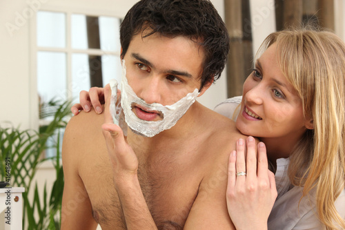 Photo: Man shaving in his bathroom Man shaving in his bathroom