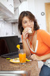 Photo: Woman eating her breakfast Woman eating her breakfast