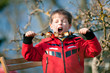 Little boy with pleasure eats grilled vegetables