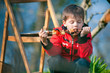Little boy with pleasure eats grilled vegetables