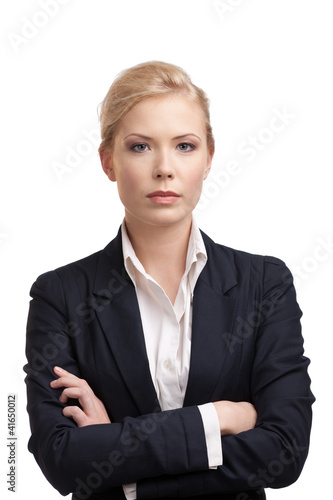 Foto: Business woman in a black suit, looking at the camera Business woman in a black suit, looking at the camera