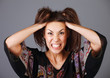 Woman stressed is going crazy pulling her hair in frustration. Woman stressed is going crazy pulling her hair in frustration.