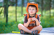 Portrait of a little boy in summer forest
