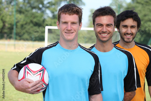 Photo: portrait of 3 football players portrait of 3 football players