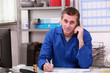 Man on the phone in a plumber's merchants