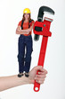 Woman holding wrench Woman holding wrench