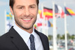 Excecutive in front of flags