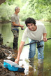 Men fishing in a river
