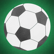 Football soccer ball by cork on green grass (clipping path)