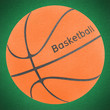 Basketball ball by cork on green grass (clipping path)