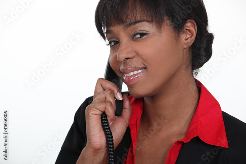 Photo: Receptionist answering a telephone Receptionist answering a telephone