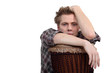 young man playing traditional drums