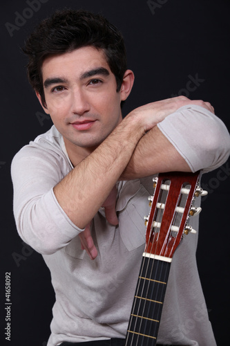 Photo: Man posing with his guitar Man posing with his guitar