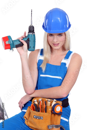 Photo: sexy craftswoman holding a drill sexy craftswoman holding a drill