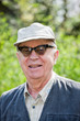Senior happy man sitting in the park
