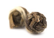 Two pieces of rolled dried jasmine over the white background Two pieces of rolled dried jasmine over the white background