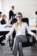 business woman with her staff in background business woman with her staff in background