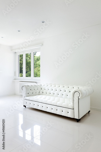 Photo: interior, leather sofa in white room interior, leather sofa in white room