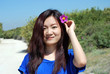 Asian girl  with the purple flower