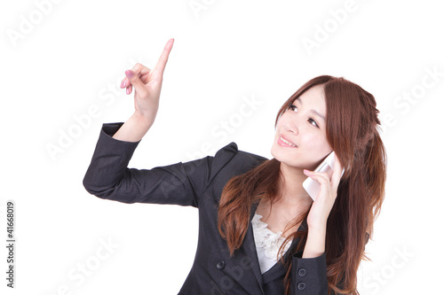 Photo: business woman speak mobile phone and finger pointing business woman speak mobile phone and finger pointing