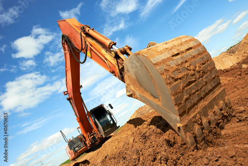 Photo: track-type loader excavator at work track-type loader excavator at work