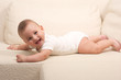 Photo: Cute baby on a sofa Cute baby on a sofa