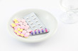 Medicine tablet dish on table.