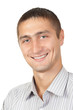 young man smiles in the striped shirt