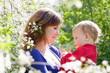 Happy mother and baby in garden Happy mother and baby in garden