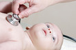 Stethoscope listening to a baby's heart beat