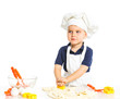 Beautiful caucasian boy making a cake